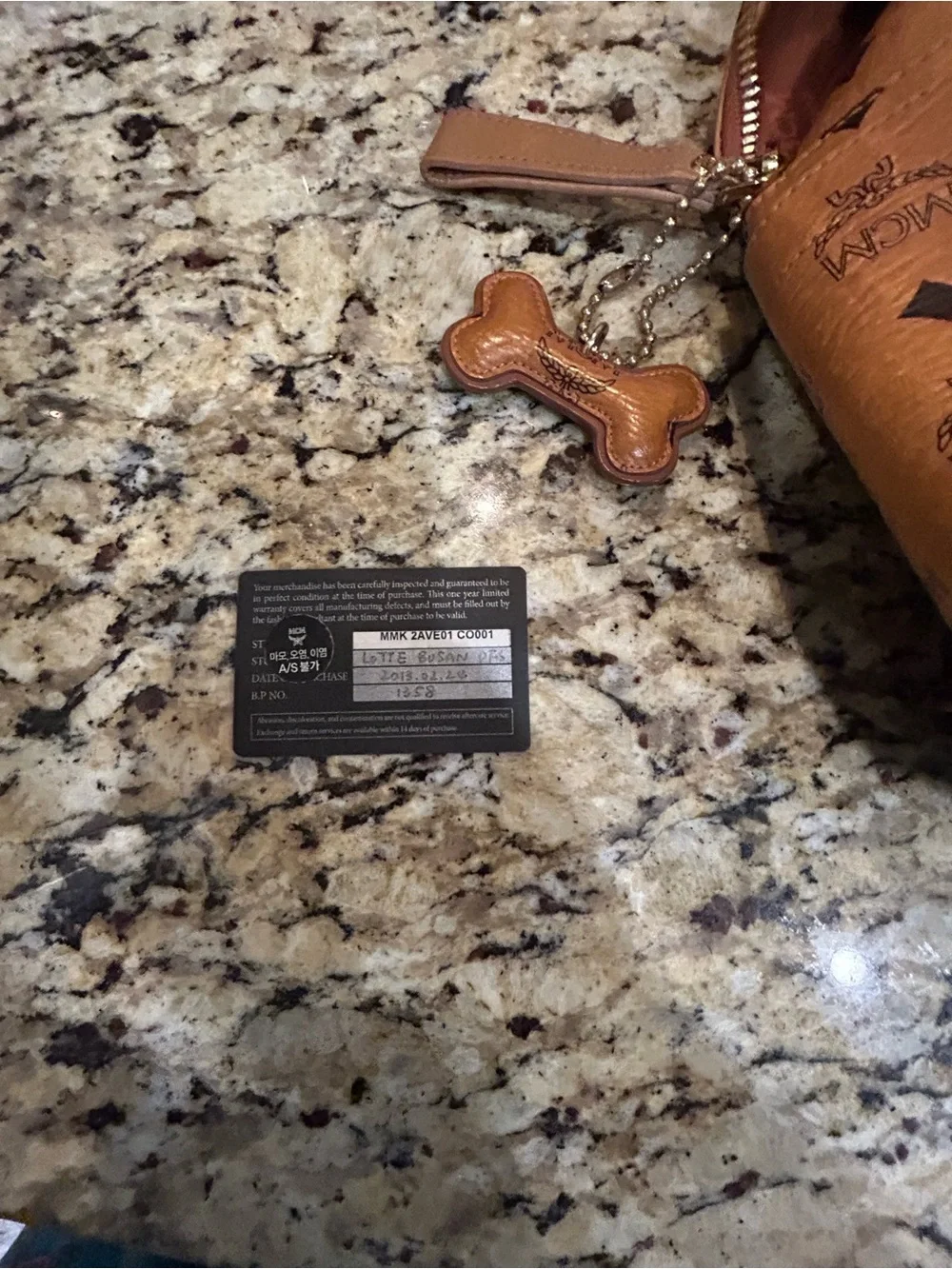 MCM Cognac Visetos Backpack Large with mcm bone bag charm and coa card.